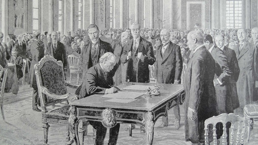 The Treaty of Versailles is signed by British prime minister David Lloyd George
