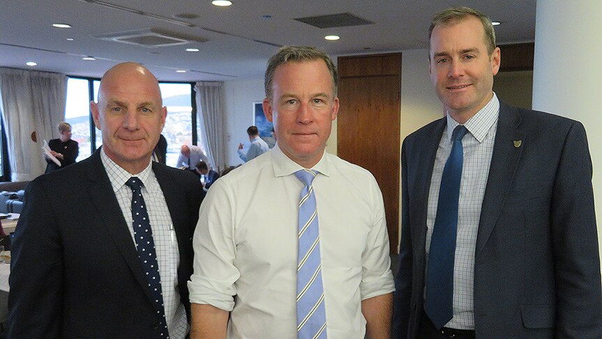 Treasurer Peter Gutwein, Premier Will Hodgman and Health Minister Michael Ferguson standing together.