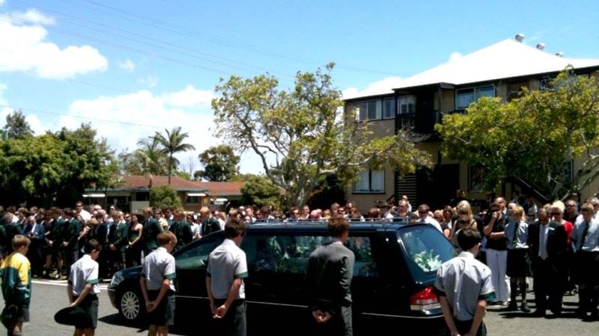 Students form an honour guard outside St Patrick's College, Shorncliffe, as the hearse passes by