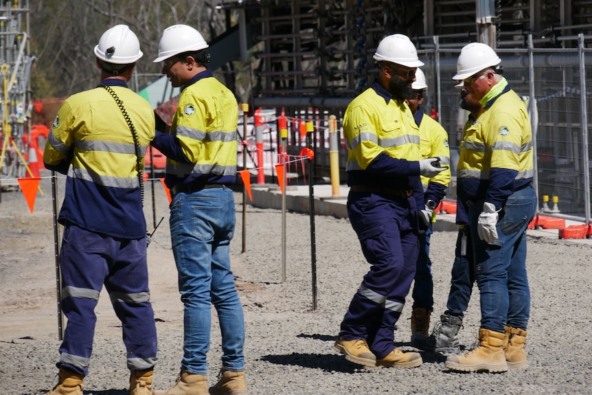 a group of workers standing