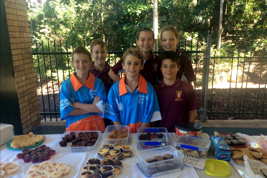 Six St Peter's Lutheran College students at a bake sale.