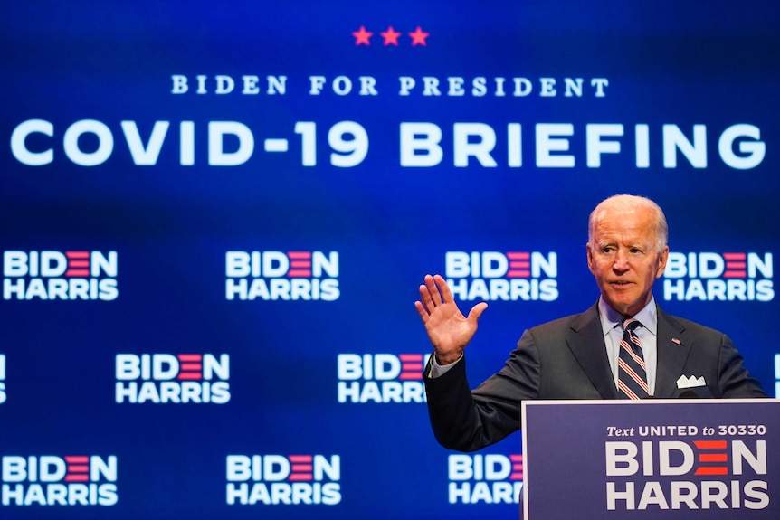 Democratic presidential candidate former Vice President Joe Biden speaks in from of a "COVID-19 BRIEFING" backdrop