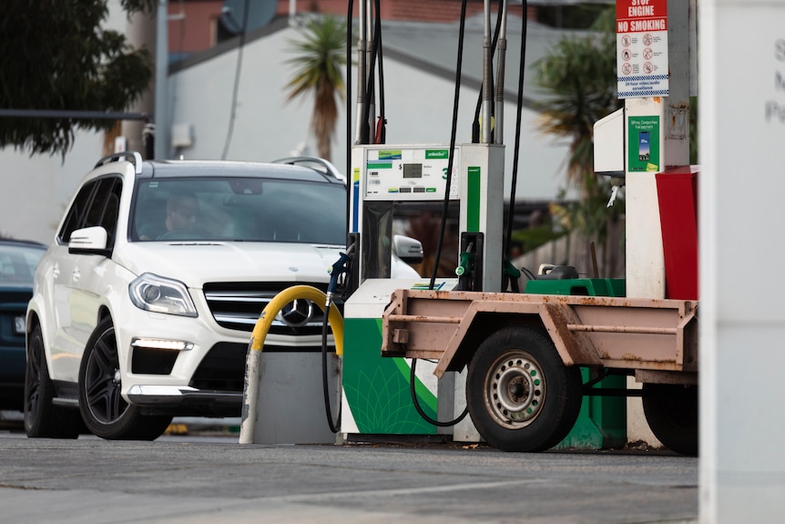 Cars line up for the petrol pump.