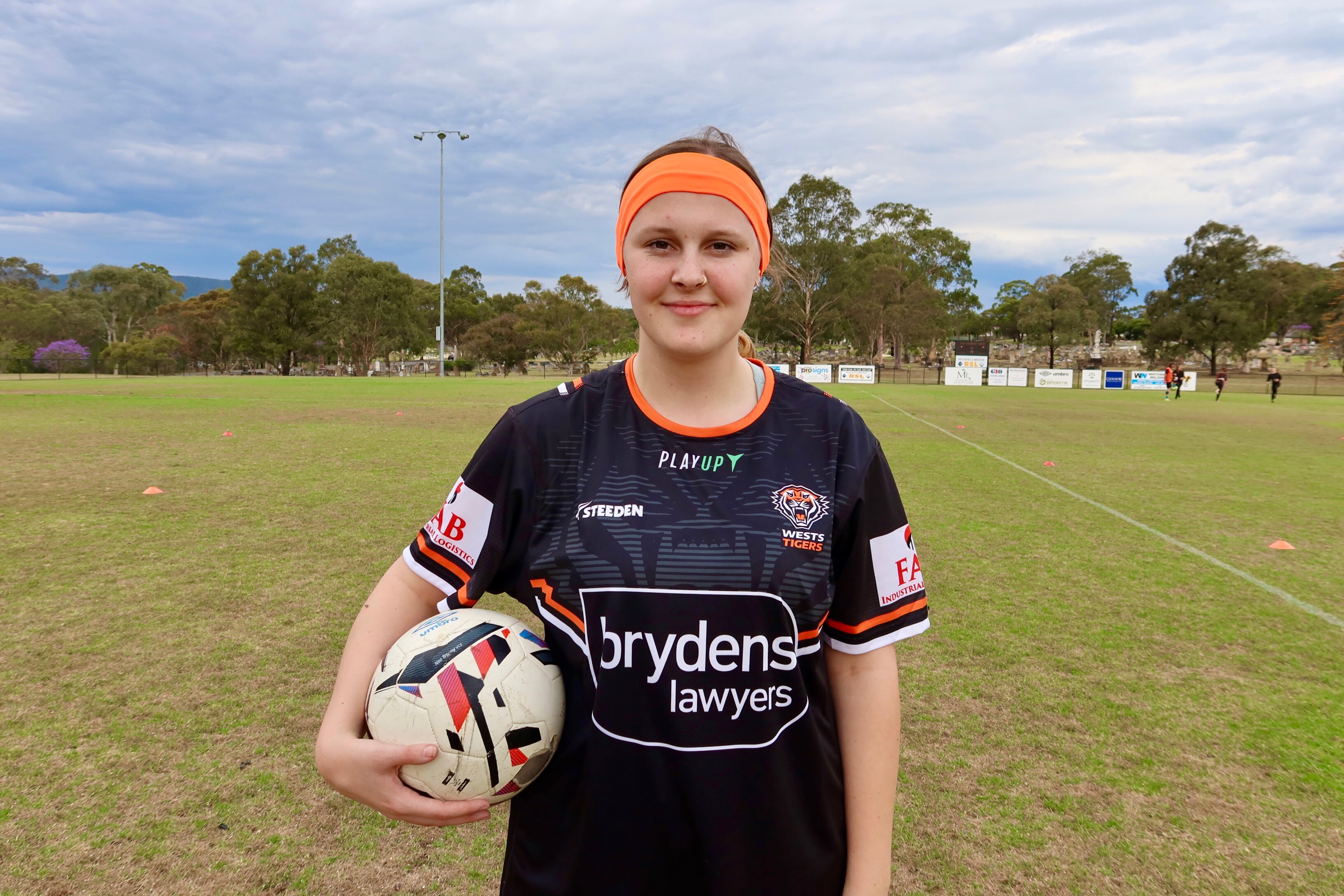 A girl with a soccer ball.