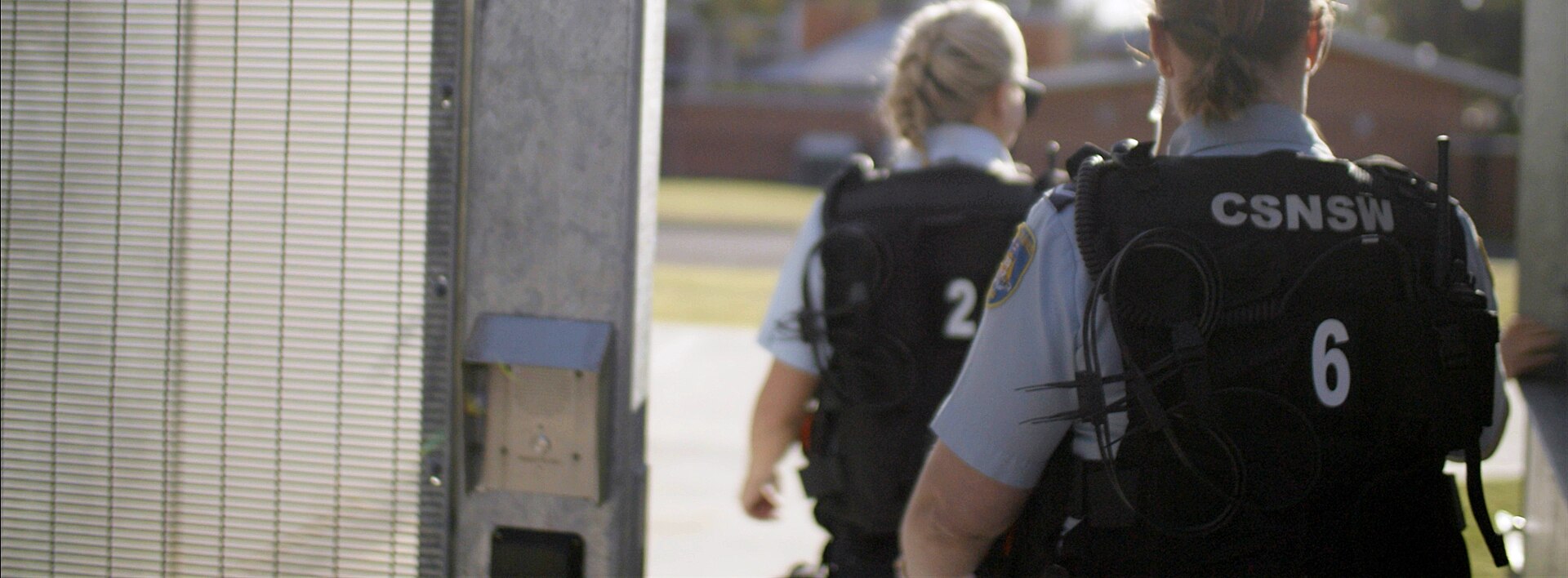 the back of two prison guard officers