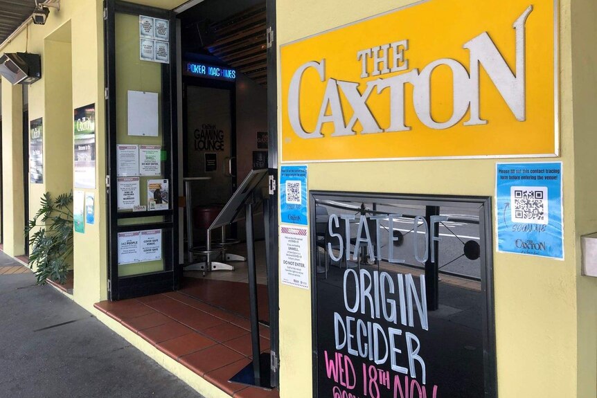 A pub with a sign that says the caxton hotel