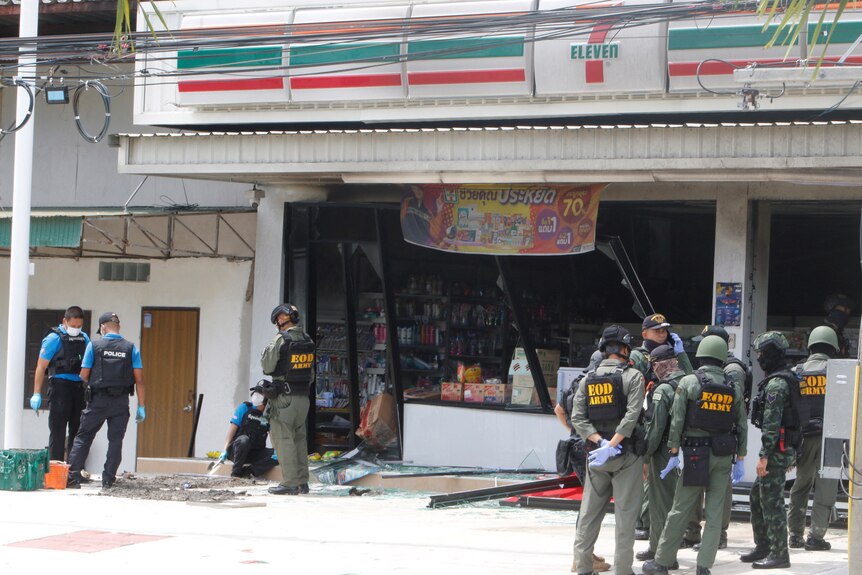 Emergency service works work in front of a shop after an explosion