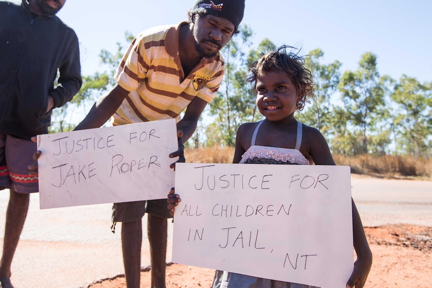 A child is among the protesters in Borroloola, NT, campaigning for justice for youth detainees.