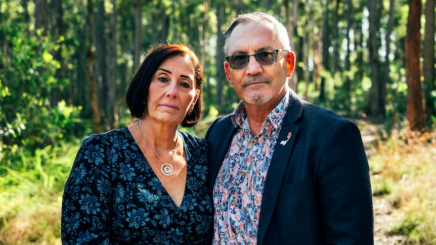 Sue and Lloyd Clarke stand on a bush track at Whites Reserve.