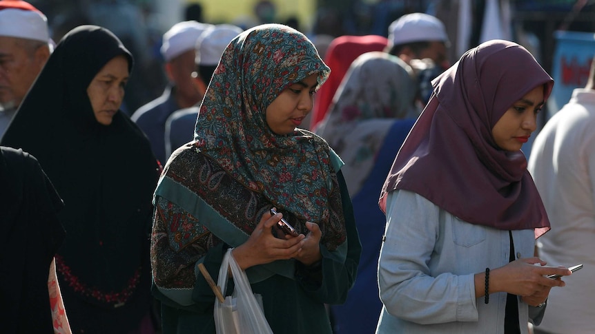 Muslim women wearing 'tudung' or headscarves shop in Kota Bharu, Kelantan, Malaysia