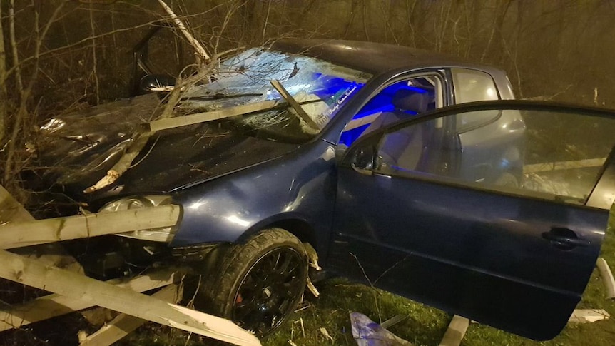 Car crash in Stourton, Leeds. Planks of wood have pierced the windshield and bonnet, branches are on top of the windshield.