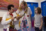 Clown Doctors Dr Quack and Doctor Smarty-Pantz entertain Sarah at Sydney Children's Hospital