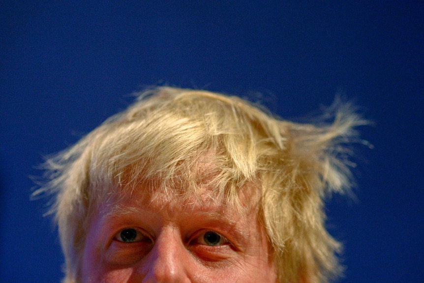 A shot of a man's messy blond hair