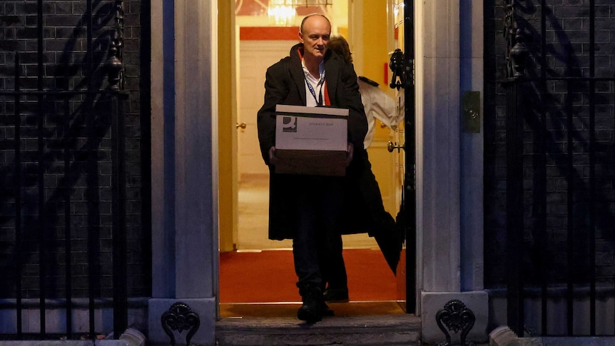 Dominic Cummings carries a box out of 10 Downing Street.