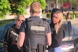 Amanda martin and another woman talk to police