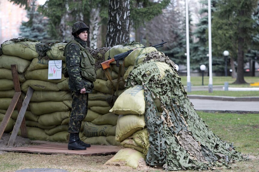 Soldier stands guard in front of Ukrainian defence ministry