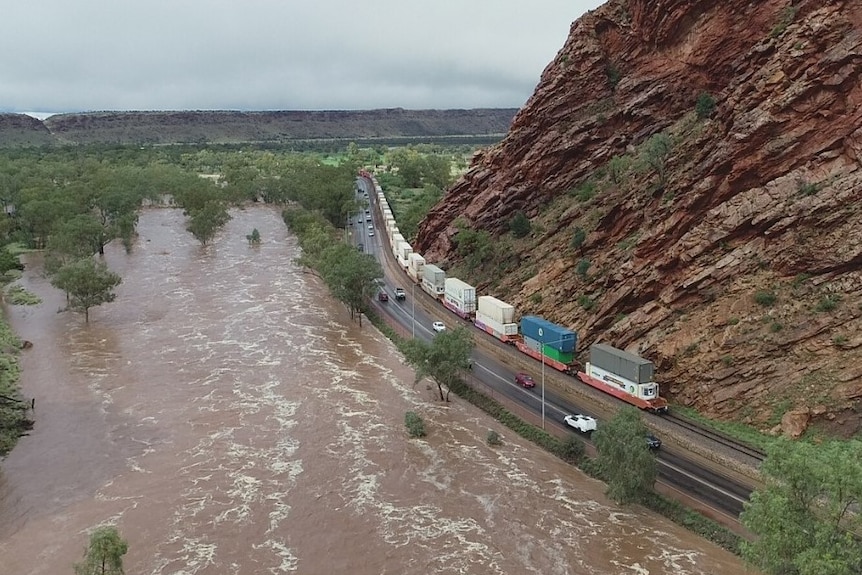 the flooded Todd River flowing through the Gap.