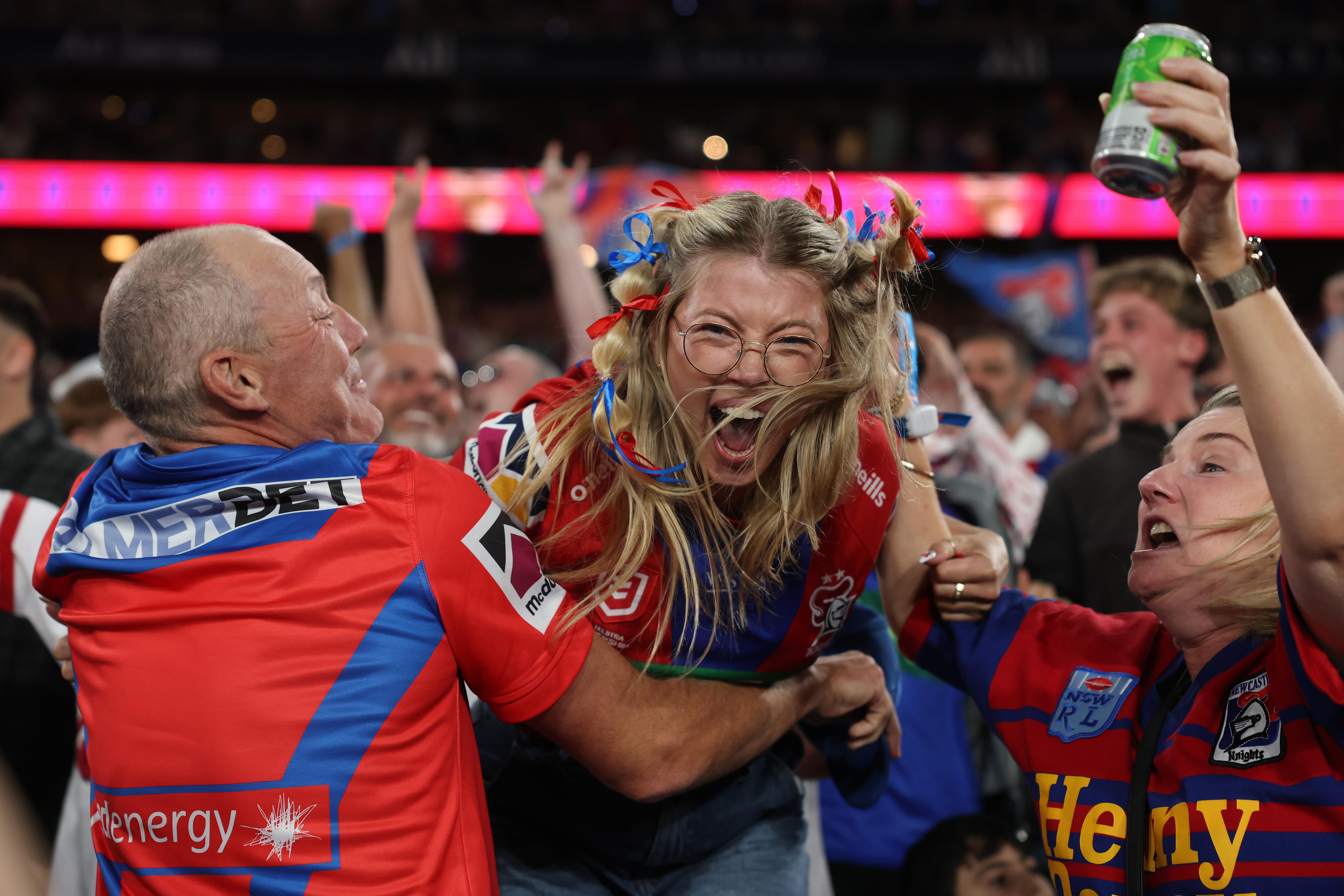 Knights fans celebrate a try in the NRL grand final 