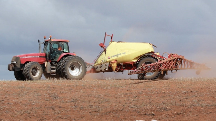 An SA Mallee farmer sprays paddocks before seeding 2014