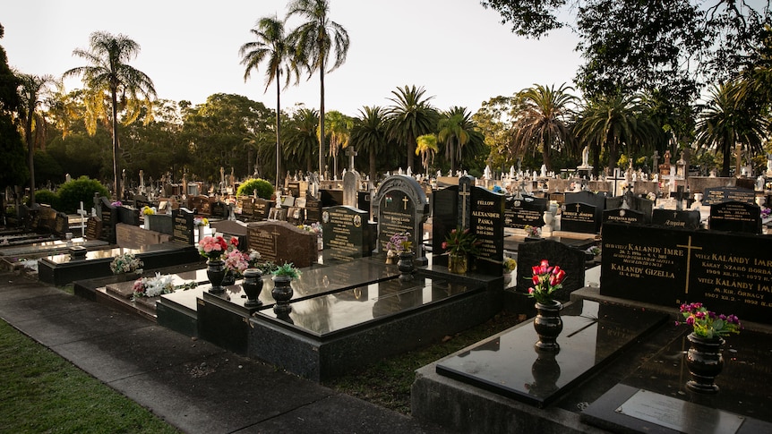 Black marble graves with gold incriptions.