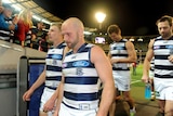 Geelong's Paul Chapman (C) walks off the MCG after the Cats' finals win over Port Adelaide.