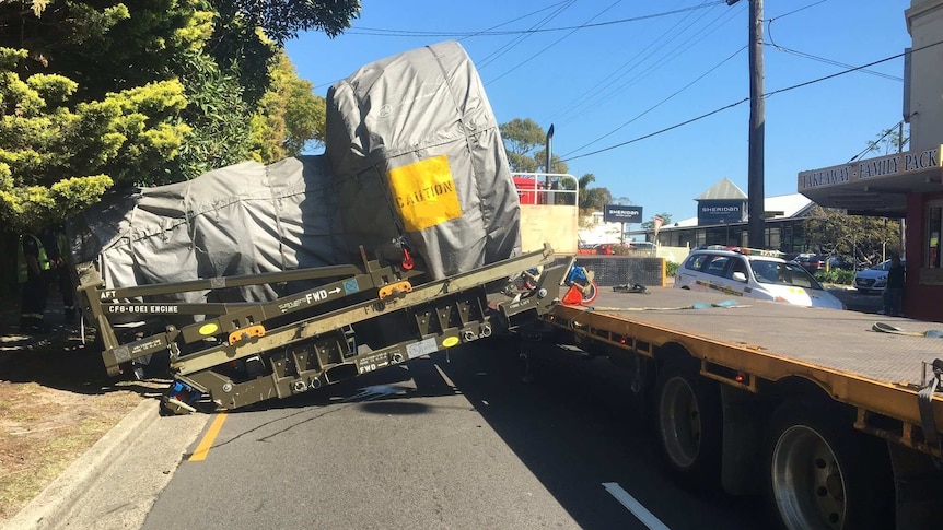 A plane engine falls of a truck.