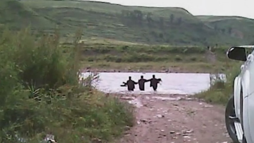 Activists wade across the Tumen River taking propaganda to North Koreans.