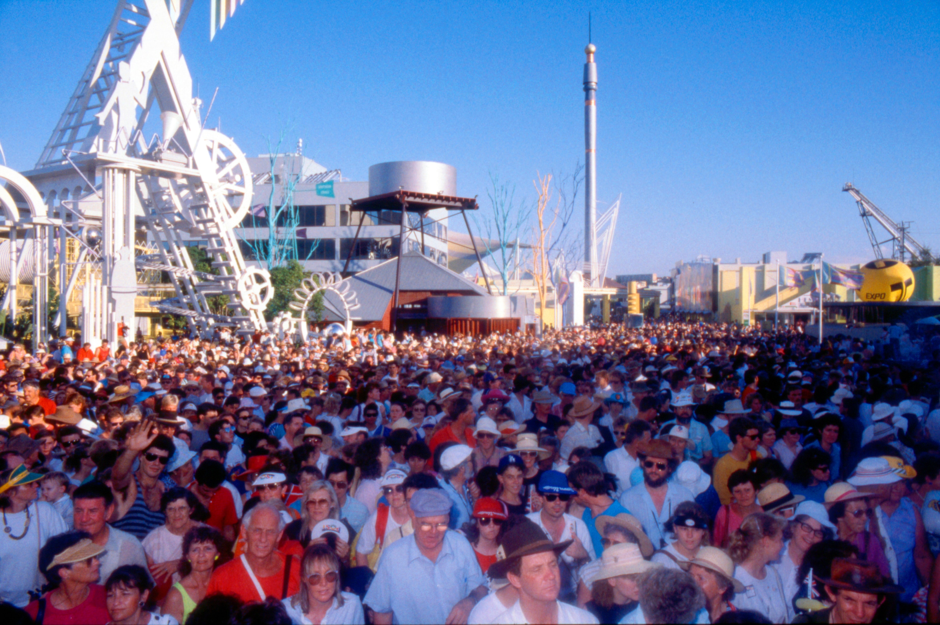 Photograph of large crowds at Expo '88 with Skyneedle pictured in background.