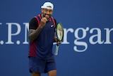 Australia's Nick Kyrgios gestures with his hand towards his team box during a match at the US Open.