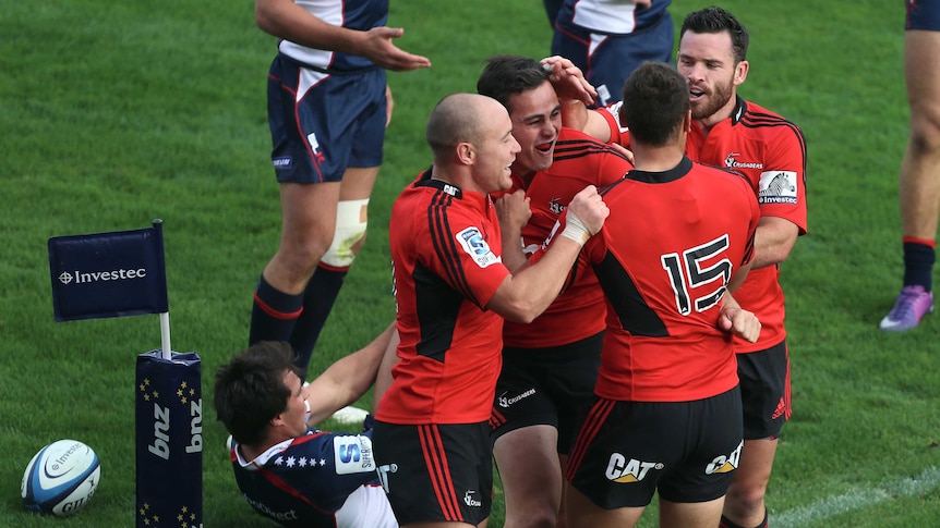 The Crusaders scored both their tries early in the match before holding off numerous Rebels attacks.