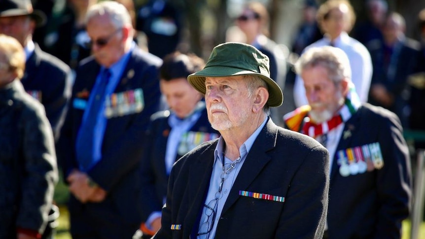 A man among the crowd attending the Vietnam War commemoration service.