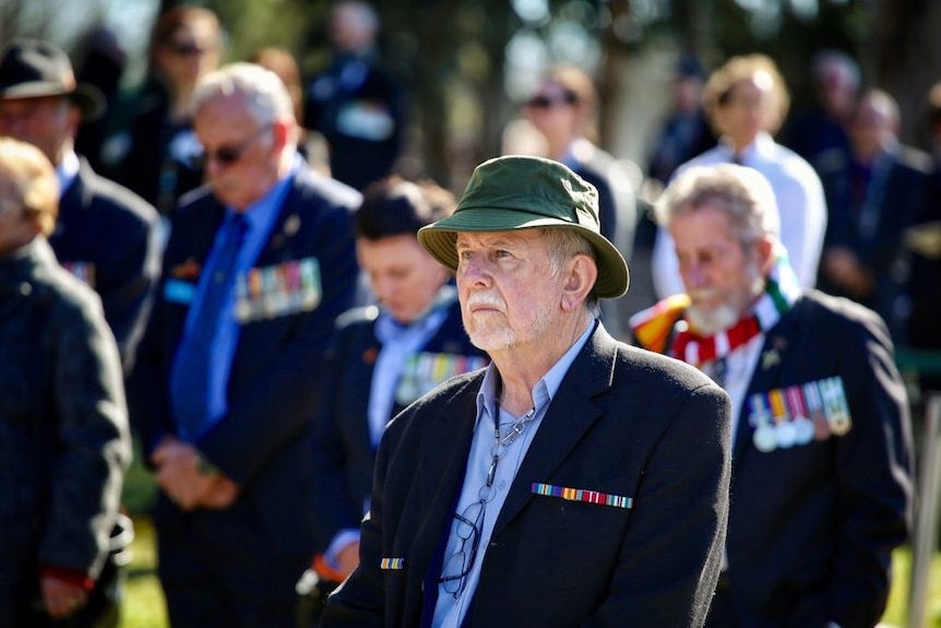 A man among the crowd attending the Vietnam War commemoration service.