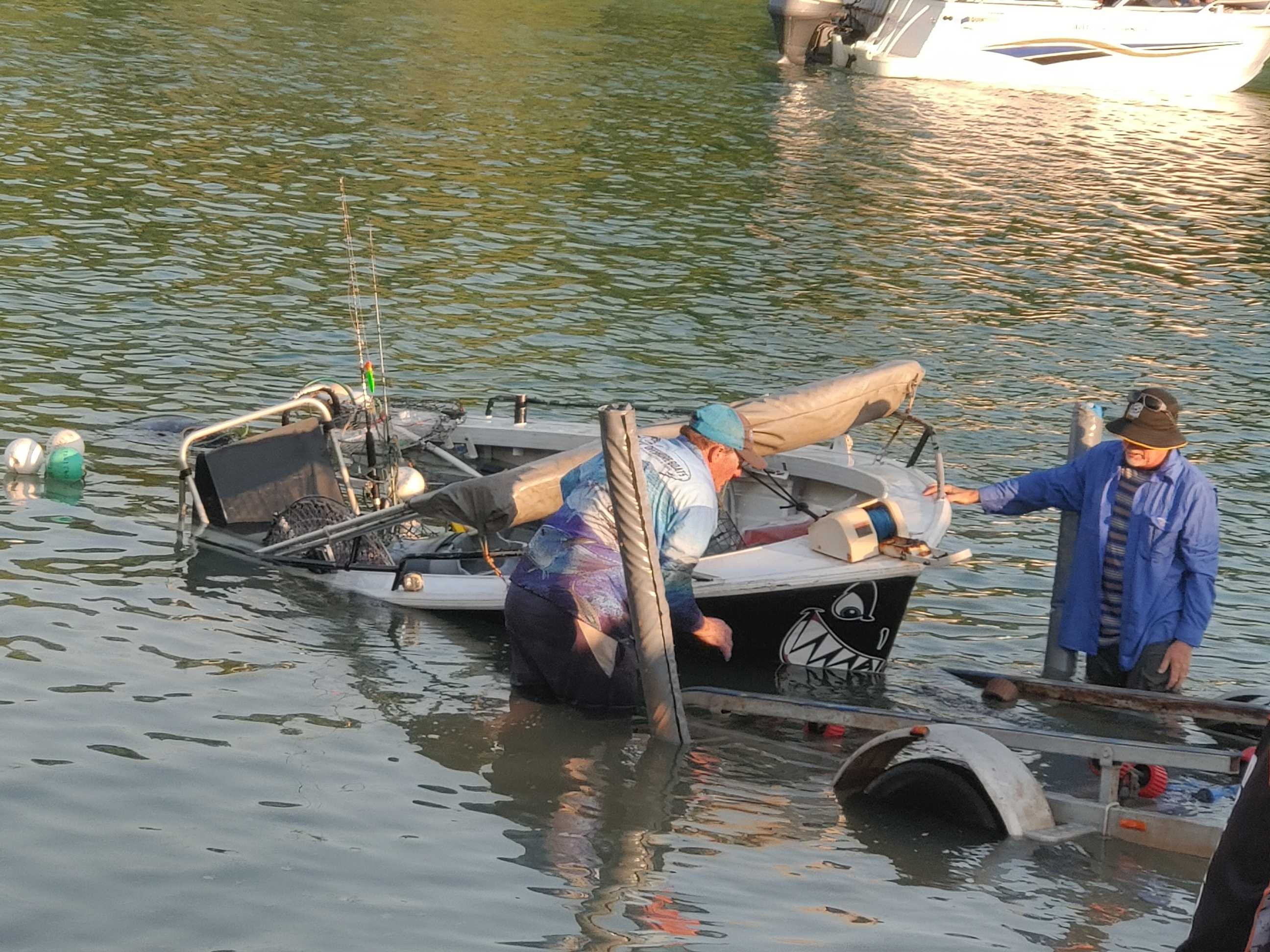 81-year-old clings to esky after boat sinks in croc-infested Darwin creek