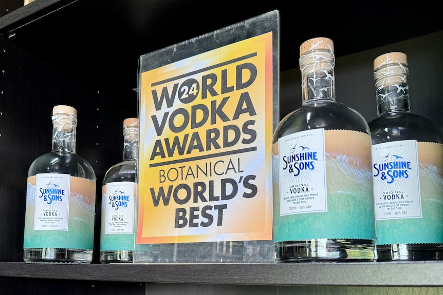 A sign saying World Vodka Awards 2024 botanical winner next to bottles of vodka.