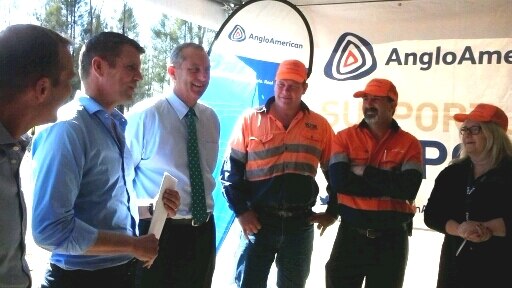 Mike Baird and Michael Johnsen with mine workers