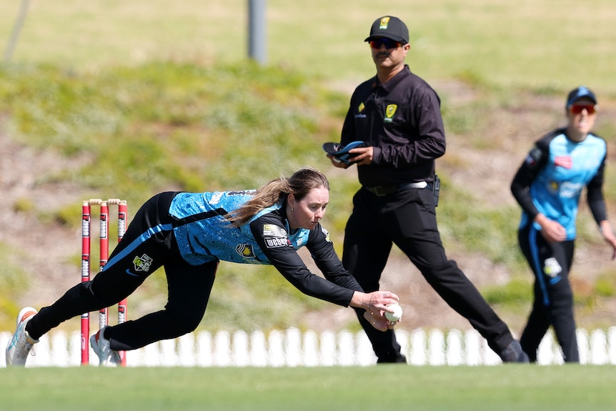 Adelaide Strikers bowler Amanda-Jade Wellington dives for a catch