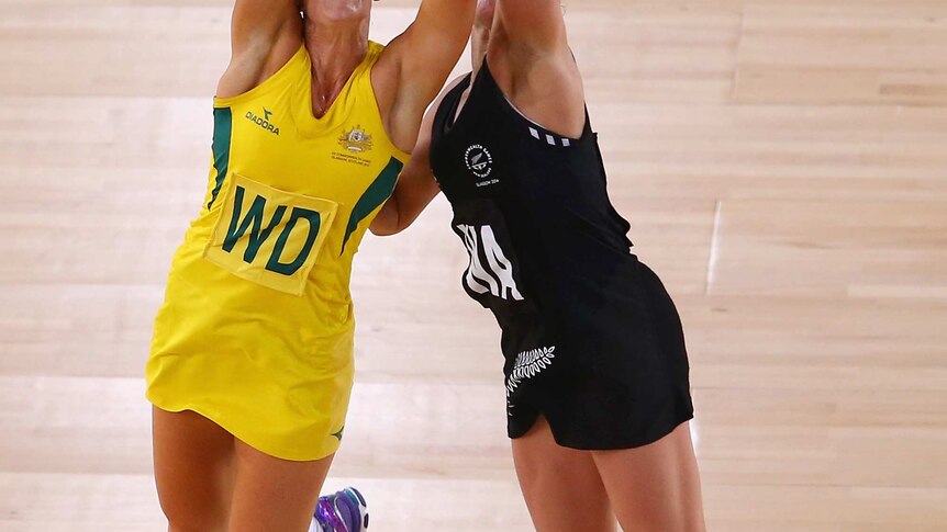 Renae Hallinan of Australia and Liana Leota of New Zealand both jumping to grab the ball.