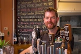 Micro brewer Nick Galton-Fenzi standing at his bar in the back blocks of Kalgoorlie-Boulder.