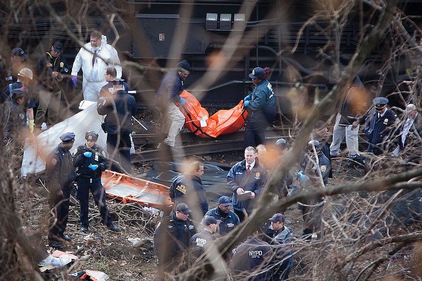 Emergency workers at scene of NYC train crash