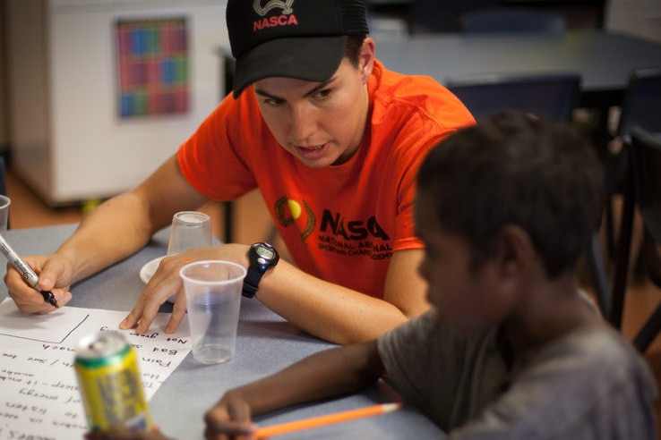 indigenous man teaching indigenous child