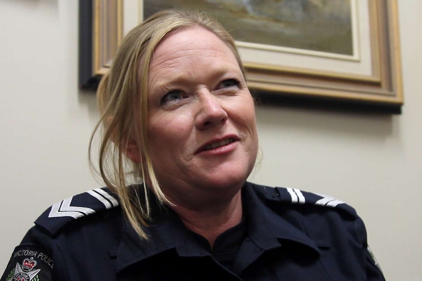 A female police officer in uniform.