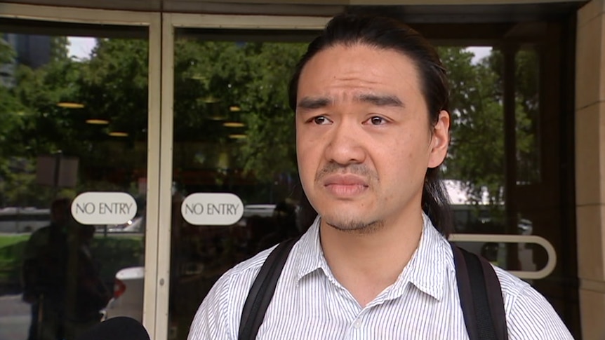 A man stands outside of court in Adelaide