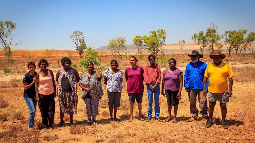 The directors of Ngan Aak-Kunch stand in front of Glencore's McArthur River zinc mine with Borroloola elders