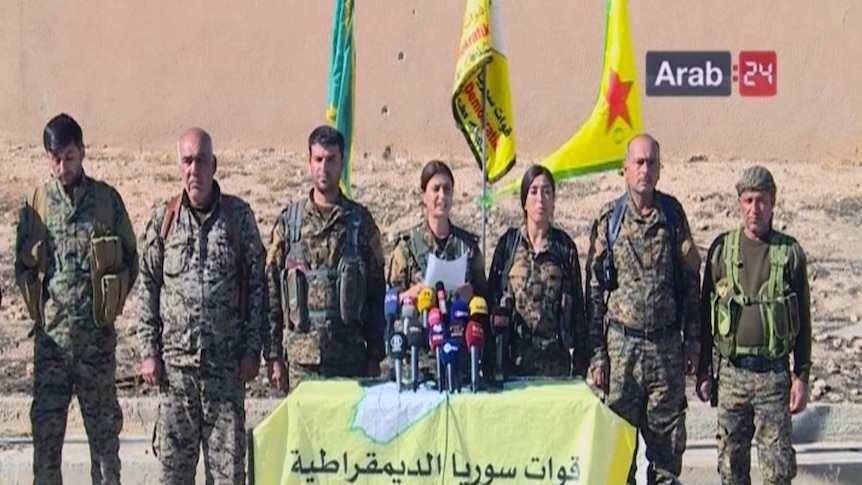 Frame grab from video provided by Arab 24 network shows officials with the US-backed Syria Democratic Forces at a press conferen