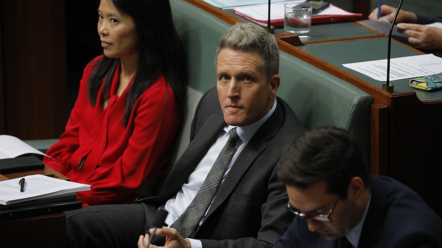 Josh Wilson sits in question time at parliament house