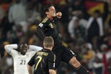 Mesut Ozil's cracker secured top spot for Germany, but Ghana progress despite the loss.