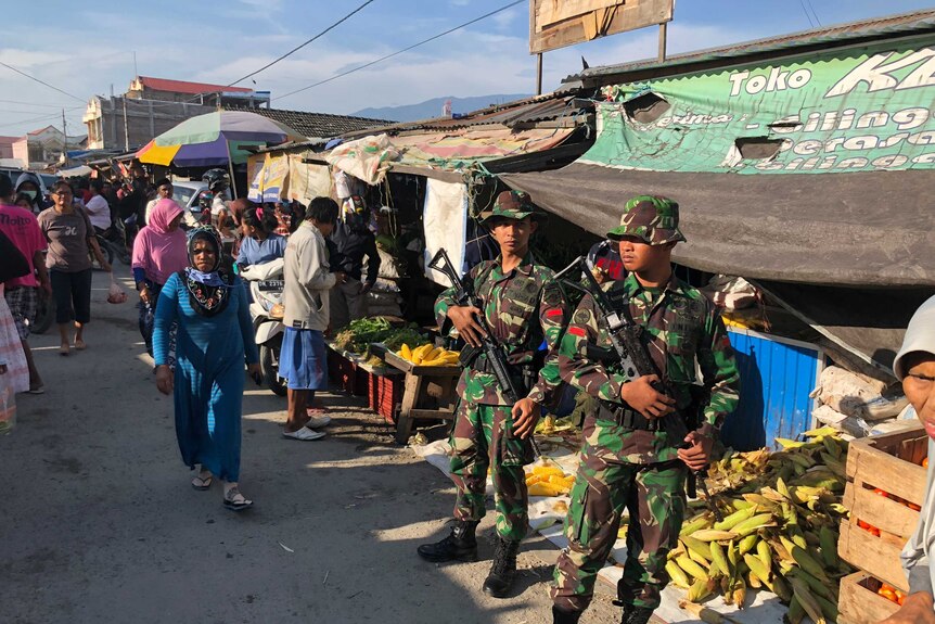 Soldiers patrol the streets of Palu