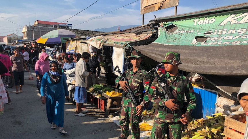 Soldiers patrol the streets of Palu