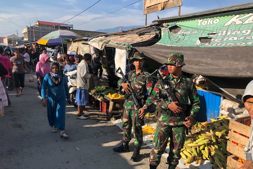 Soldiers patrol the streets of Palu