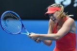 Sharapova hits a backhand against Bouchard